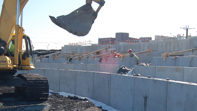 Preparing foundations for seating in Penn Park softball stadium.