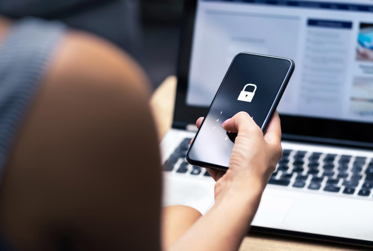 Person using phone for computer log-in